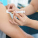 Blurry Background of Nurse are vaccinations to patient. To prevent diseases that are prevalent. closed-up of hand with vaccine shot.
